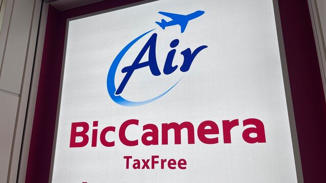 Air BicCamera TaxFree store logo sign for electronics retailer at Haneda Airport (HND), a duty-free shop for tourists - Tokyo, Japan, December 6, 2025