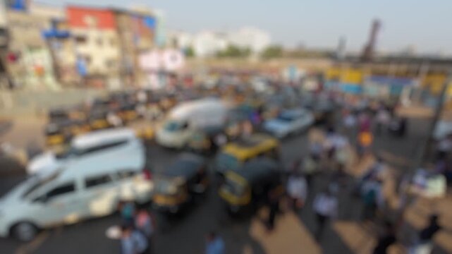 Bokeh view of road traffic near Bandra railway station, Mumbai, India. Blurred background footage.