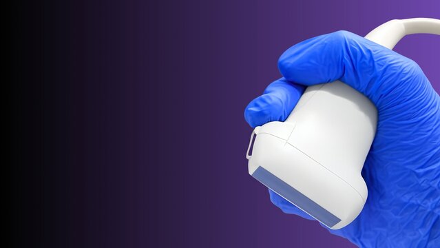 A close‑up image of a gloved hand holding a medical ultrasound probe, representing diagnostic imaging and modern healthcare technology.