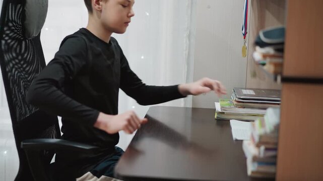 Teen at desk writing homework, concentrated student fills pages with notes using pen and pencil, quiet curtainlit corner, stacks of textbooks and stationery, determined study atmosphere