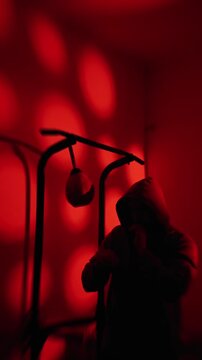 Nighttime Home Training. Bright Red Fitness Session In Darkness. Gritty Nighttime Style Exercise Illuminated By Vibrant Neon And Red Bokeh Effects In Darkness. slow motion