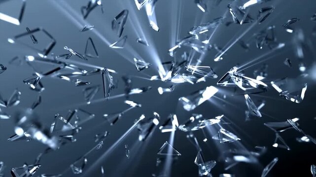 Slow motion closeup of glass shards exploding and scattering with radiating light rays in dark indoor studio environment, reflective crystal fragments in motion