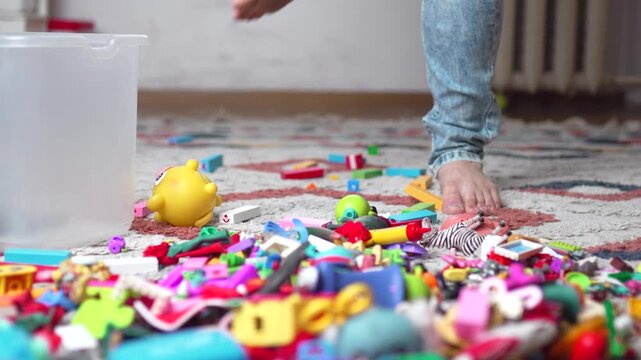 Barefoot Man Stepping on Toy Block on Hardwood Floor - 4K.