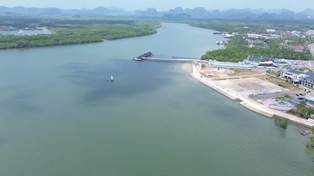 Aerial view of the HTMS Lanta warship museum featuring a decommissioned naval ship and aircraft display near Klong Jilad Ferry Pier in Krabi Thailand coastal area.
Surrounded by stunning nature.