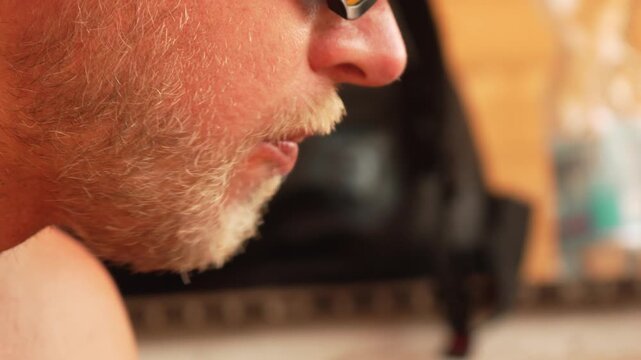 Man Beard Close-up Portrait of a man with a beard looking down.