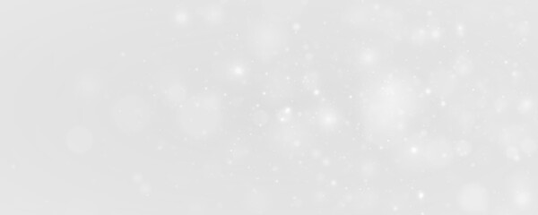 Silver sparkling snow dust glow light, sparkle, glitter across bokeh. Twinkle particle, stardust highlights flare while sparks, snowflake, glare, lens flare, magical PNG winter illustration. © Mirotvoric