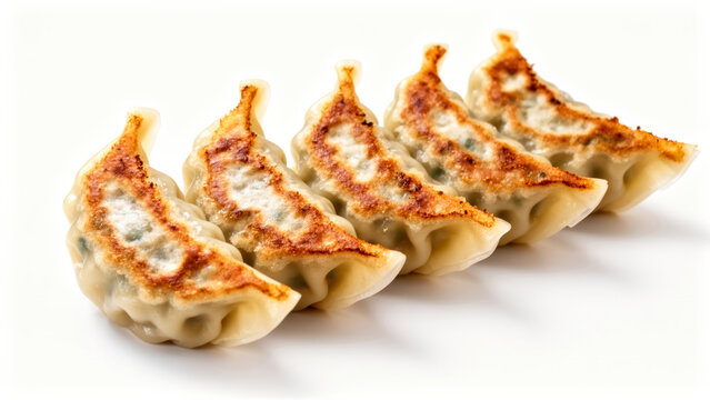 Five crispy pan-fried gyoza dumplings arranged in a row, representing Japanese culinary tradition and authentic appetizing savory Asian snack food culture.