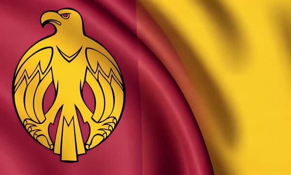 The national flag of Kirovohrad Oblast waving in the wind displays a bird emblem on red and yellow fabric.