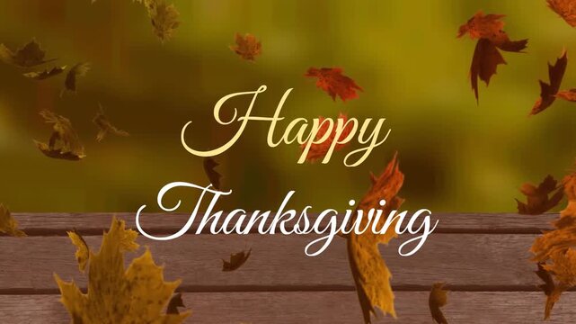 Animation of happy thanksgiving text over leaves and wooden table against trees