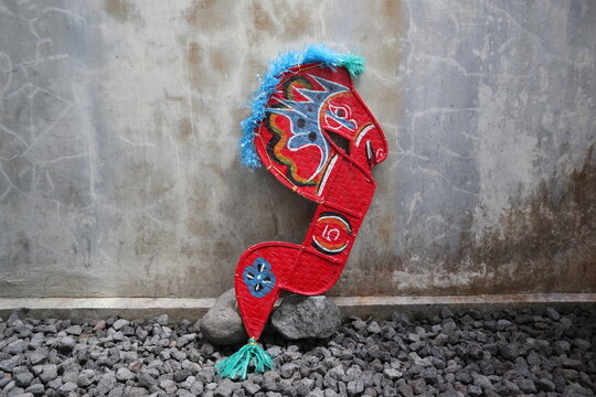 in Indonesia, it is called kuda lumping, horse-shaped bamboo props in traditional Javanese dance, a flat horse made from bamboo woven