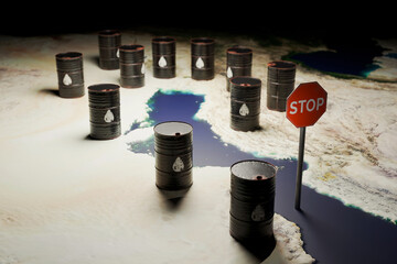 Hormuz Blockade. Visualizing the Iranian oil embargo and the strategic closure of the Strait of Hormuz. Small oil barrels and a stop sign on a map illustrate world energy trade risk.