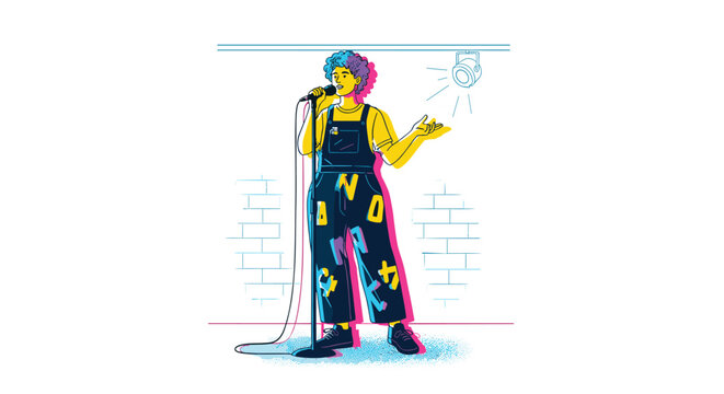 A nonbinary person with curly hair in letter-adorned overalls performs poetry with a microphone on a stage under a spotlight.