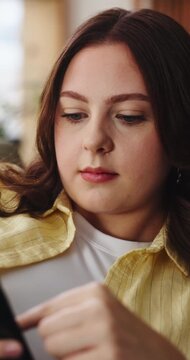 Home, scroll and woman on sofa with phone for online dating, social media addiction and chat. Apartment, weekend and person on smartphone for connection, communication and text message on mobile app