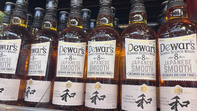 Dewar's Japanese Smooth Blended Scotch Whisky aged 8 years with Mizunara Oak Cask Finish bottles on a retail store shelf - Japan, August 27, 2025