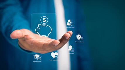 Businessperson hand presenting digital piggy bank savings, financial planning icons including emergency fund, retirement, security, and family responsibility for long term wealth management strategy © LAONG