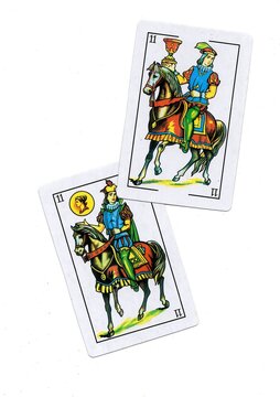 A pair of traditional Spanish playing cards isolated on a white background.