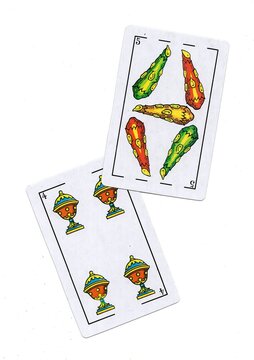 A pair of traditional Spanish playing cards isolated on a white background.