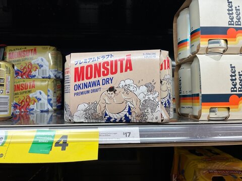 Monsuta Okinawa Dry Premium Draft beer multi-packs on supermarket shelf at Westpac nearby shopping area with price tags and Better Beer cans - Auckland, New Zealand, February 7, 2023
