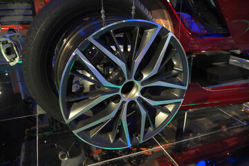 Fototapeta premium Modern alloy car wheel and tire close up on vehicle display
