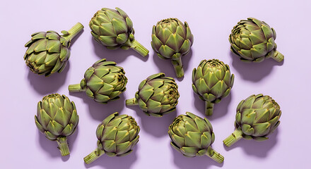Fototapeta premium A vibrant flat lay of fresh green artichokes arranged on a lilac surface on transparent