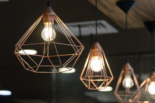 Modern copper wire cage pendant light fixture.
