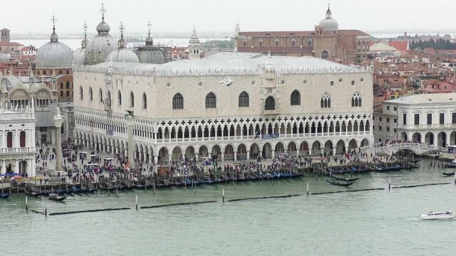 Panoramic view of Doge&rsquo;s Palace and surrounding historic buildings in Venice with waterfront and gondolas.