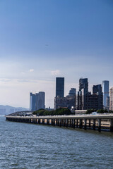 Obraz premium Xiamen Waterfront Skyline with Modern Architecture and Coastal Pier
