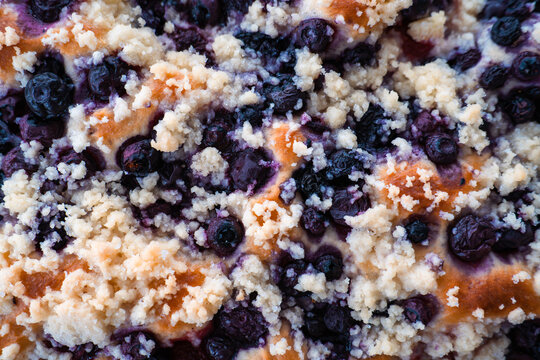 Close-up texture of homemade blueberry cake with butter crumble