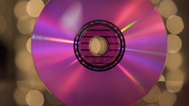 CD Digital Audio with iridescent because on readable surface of compact disc on abstract background close-up