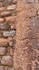 Fototapeta premium Two Distinct Weathered Wall Textures Separated by an Uneven Vertical Seam