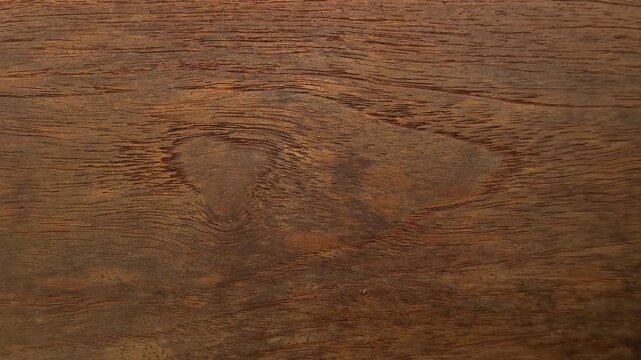 4K Macro Texture of Dark Brown Wood Grain with Heart-Shaped Knot