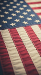 Fototapeta premium Close-up of a textile flag with stripes and stars, showcasing patriotic symbol, representing nation, freedom, and national identity