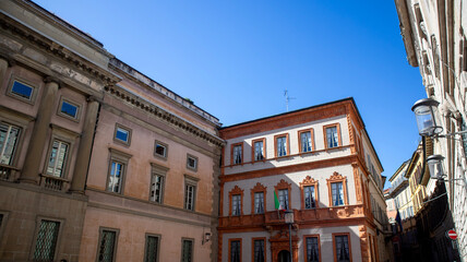 Fototapeta premium Historic buildings on a narrow street in an old European city Milan