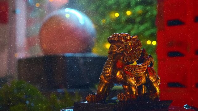 A beautiful decorative illuminated fountain "Floating Ball" with figurines of a snow lion, a character from Buddhist mythology, a faithful servant of Buddhas and bodhisattvas. Slow mo, slow motion