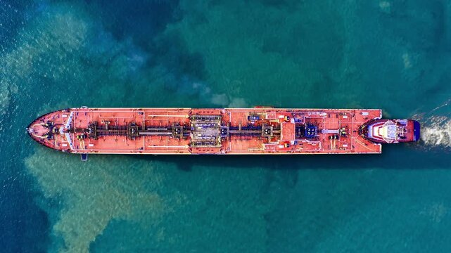 Aerial view of a petroleum tanker transporting crude oil across calm waters, showcasing efficient maritime logistics in the energy sector