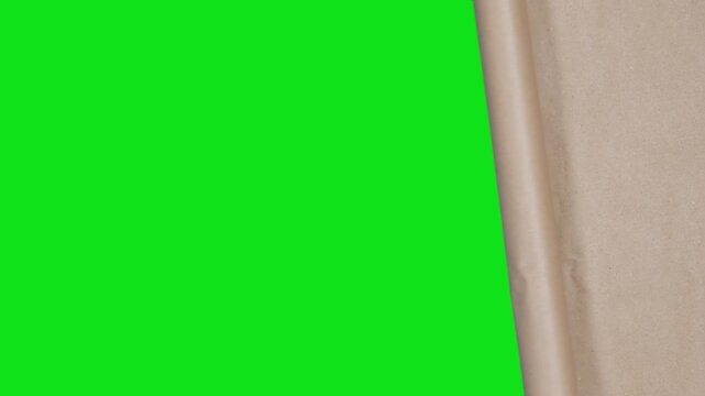 Horizontal two-stage unfinished rolling craft paper transition on green screen. Naturally optically captured with camera. Designed for custom reveal timing.
