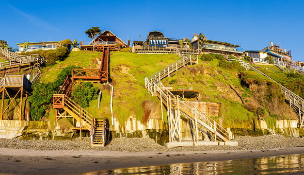 Wooden Stairways Descending Steep Cliffs to Grandview Surf Beach, Encinitas, California, USA