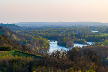 Naklejka premium Confluence of the Ariège and Garonne rivers at sunset in spring, seen from Pech David hill