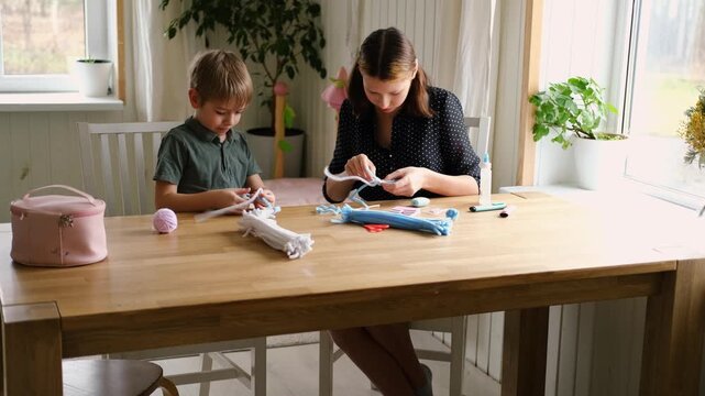 Happy Children Laugh and Fun Make DIY Toys. Kids Crafting from Fluffy wire, Bending Plush. Craft Pipe Cleaners. Leisure on Holidays. Thick Fluffy Chenille Stems for Arts. Supplies, Chenille Stems.