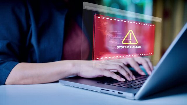 Cybersecurity warning on laptop screen showing system hacked alert, symbolizing data breach, cyber attack, malware threat, network security risk and digital protection in modern technology environment