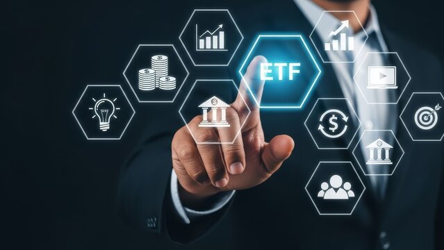 Businessman points to a glowing "etf" icon surrounded by various financial and investment symbols.