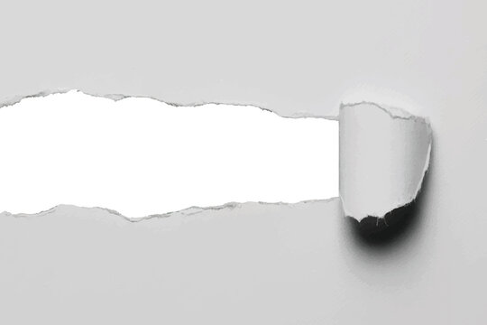 Ripped white paper with torn hole and curled edges, isolated on white background.