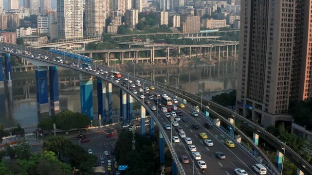 Aerial view of Yumao Bridge with light rail and city traffic in Chongqing China