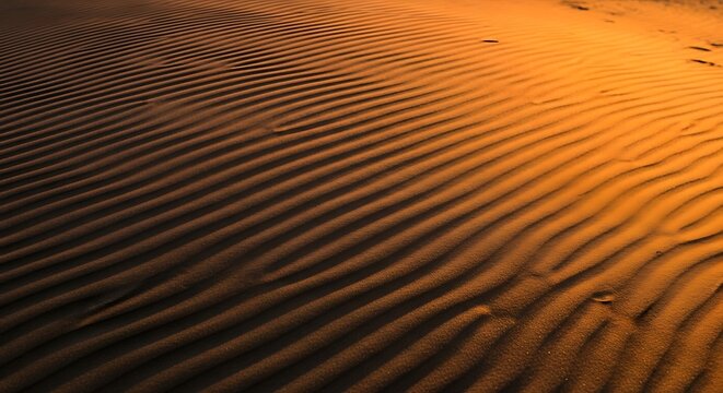 Closeup golden brown wavy parallel lines texture in warm low light illumination