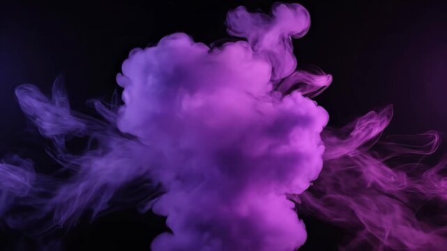 Purple and pink smoke dissolving into dark black background