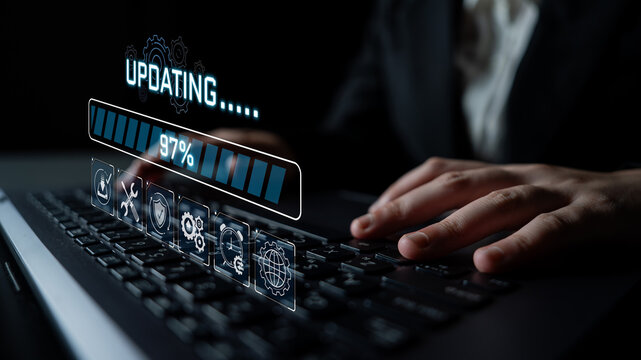 Futuristic businessman typing on a modern laptop while updating software, digital progress bar displaying completion status in a dark workspace environment Sigmoid