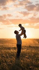 Fototapeta premium A father lifts his child joyfully in a golden wheat field during sunset, capturing a tender moment of bonding and happiness.
