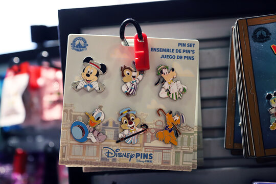 Disney collectible pin set featuring classic characters for sale in souvenir shops