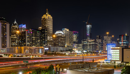 Fototapeta premium Atlanta Night Skyline with Light Trails on Highway and Illuminated Midtown Towers