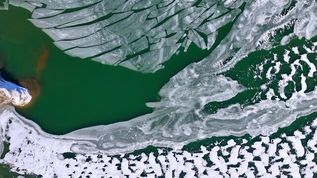 Winter aerial view featuring a frozen quarry in Dover, New Hampshire